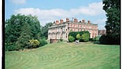 Berwick House, Shropshire – Red-brick country house with manicured lawns and specimen topiary shrubs.