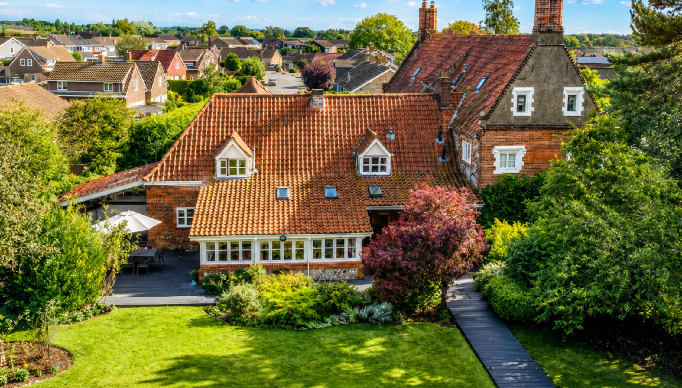 Catton Old Hall, Norfolk – Brick country house with terracotta tile roof and manicured lawns, surrounded by mature trees.