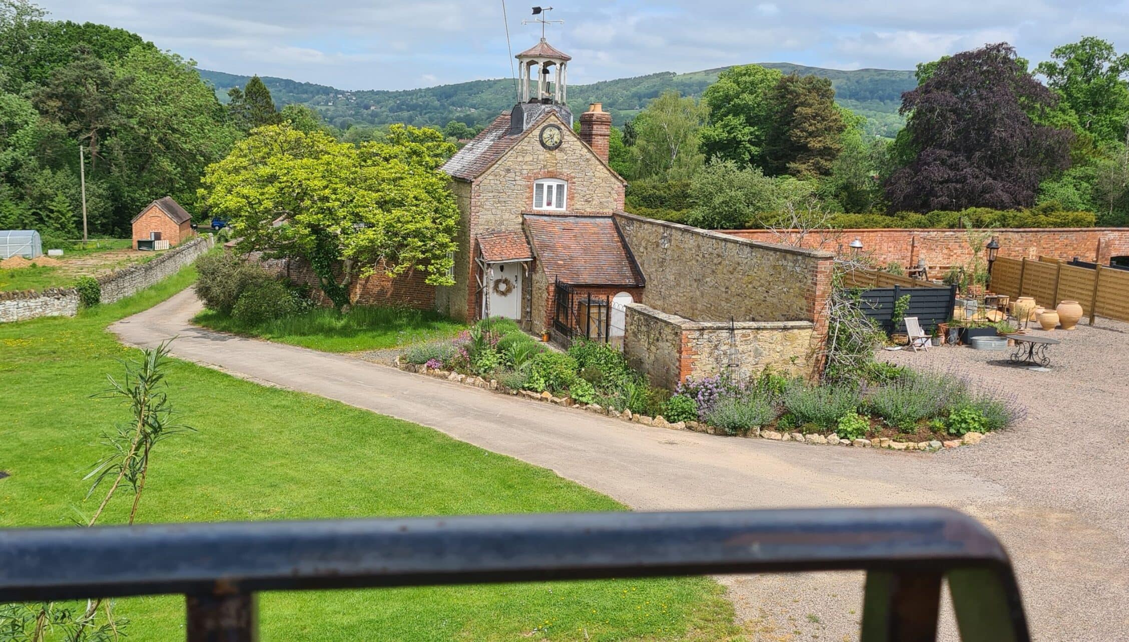 Barton Court, Herefordshire – Converted brick chapel with bell tower and adjoining stone farm buildings in rural grounds.