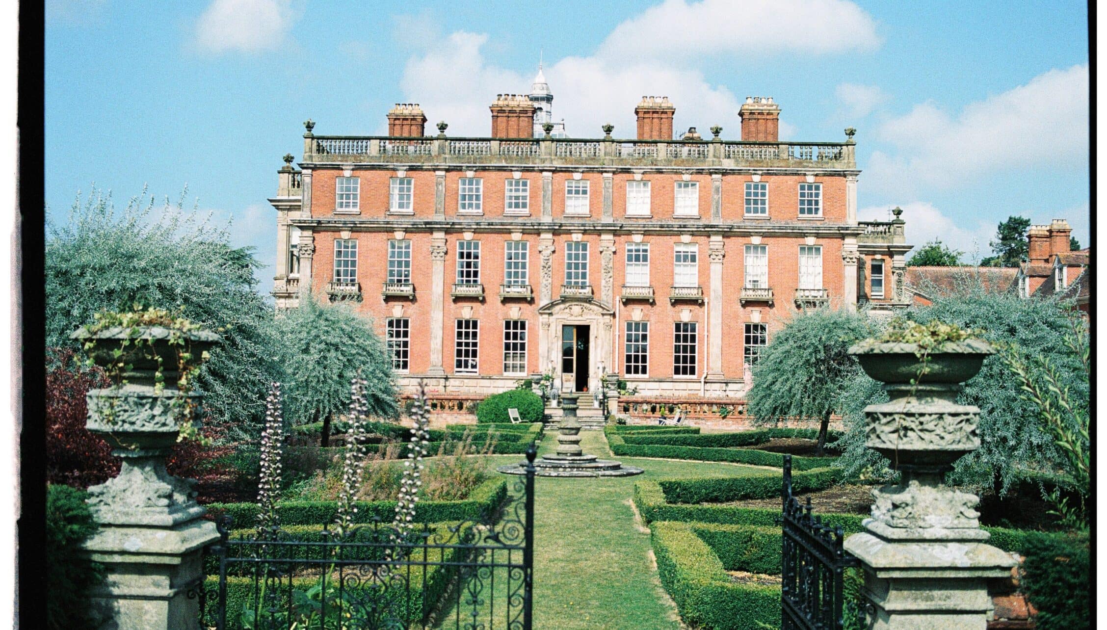 Berwick House, Shropshire – Red-brick country house with formal gardens, stone urns and ivy-covered walls.