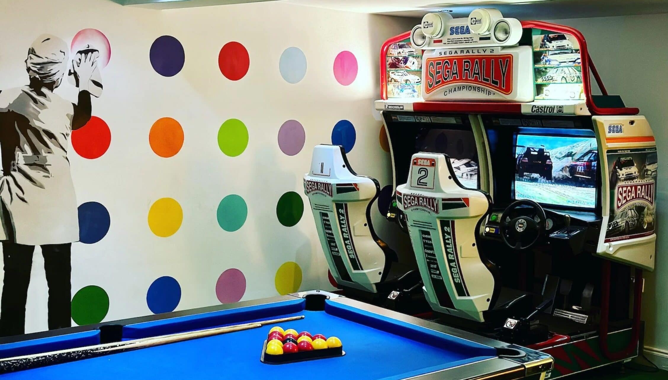 Hill House Norfolk, Norfolk – Games room with pool table, Sega Rally arcade machines and colourful wall art.