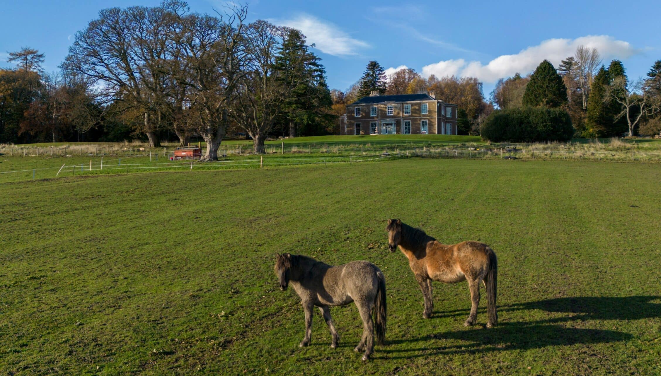 Manar House, Aberdeenshire – Georgian country house with paddocks and grazing horses in parkland setting.