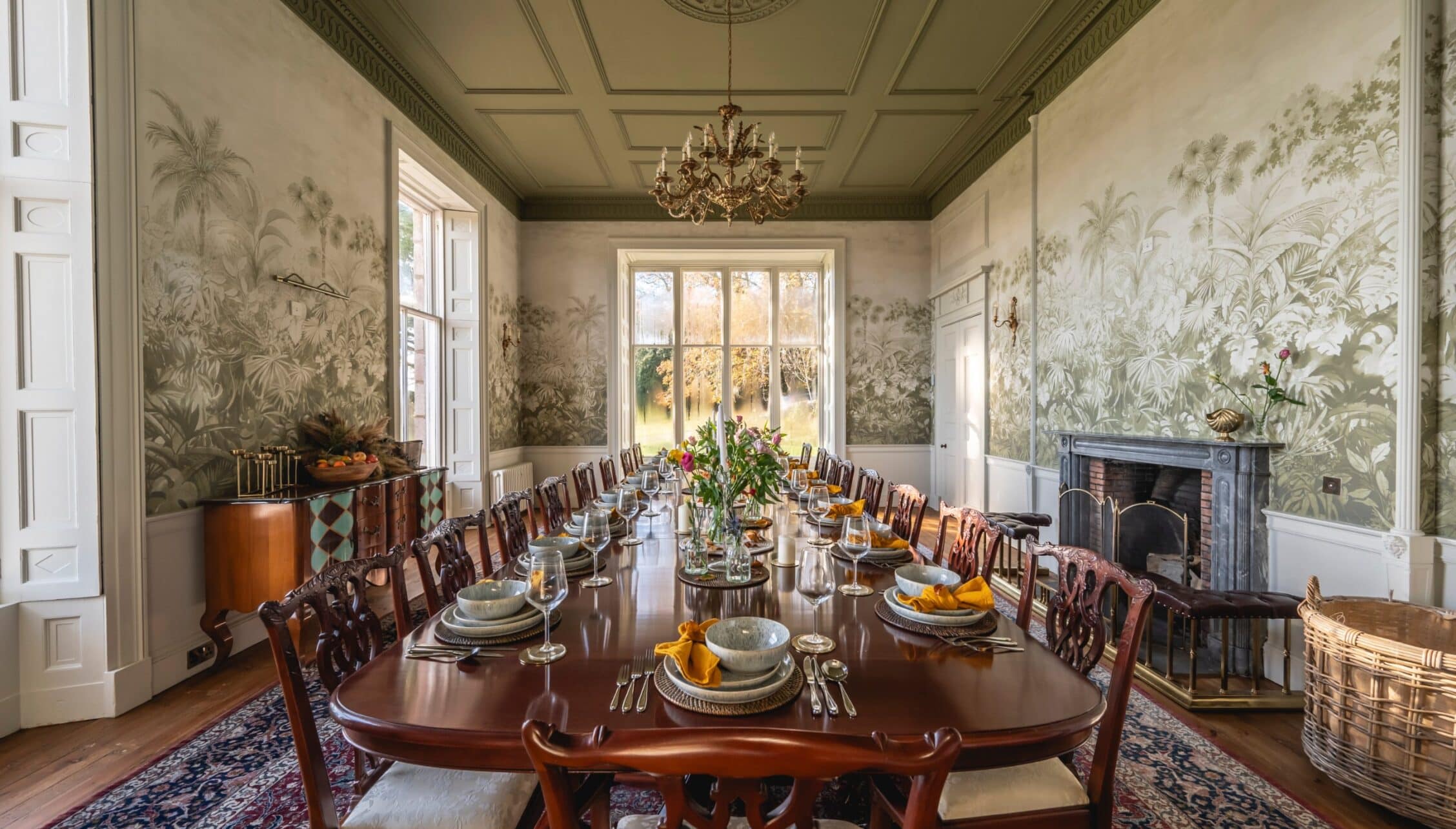 Manar House, Aberdeenshire – Formal dining room with chinoiserie wallpaper, mahogany table and marble fireplace.