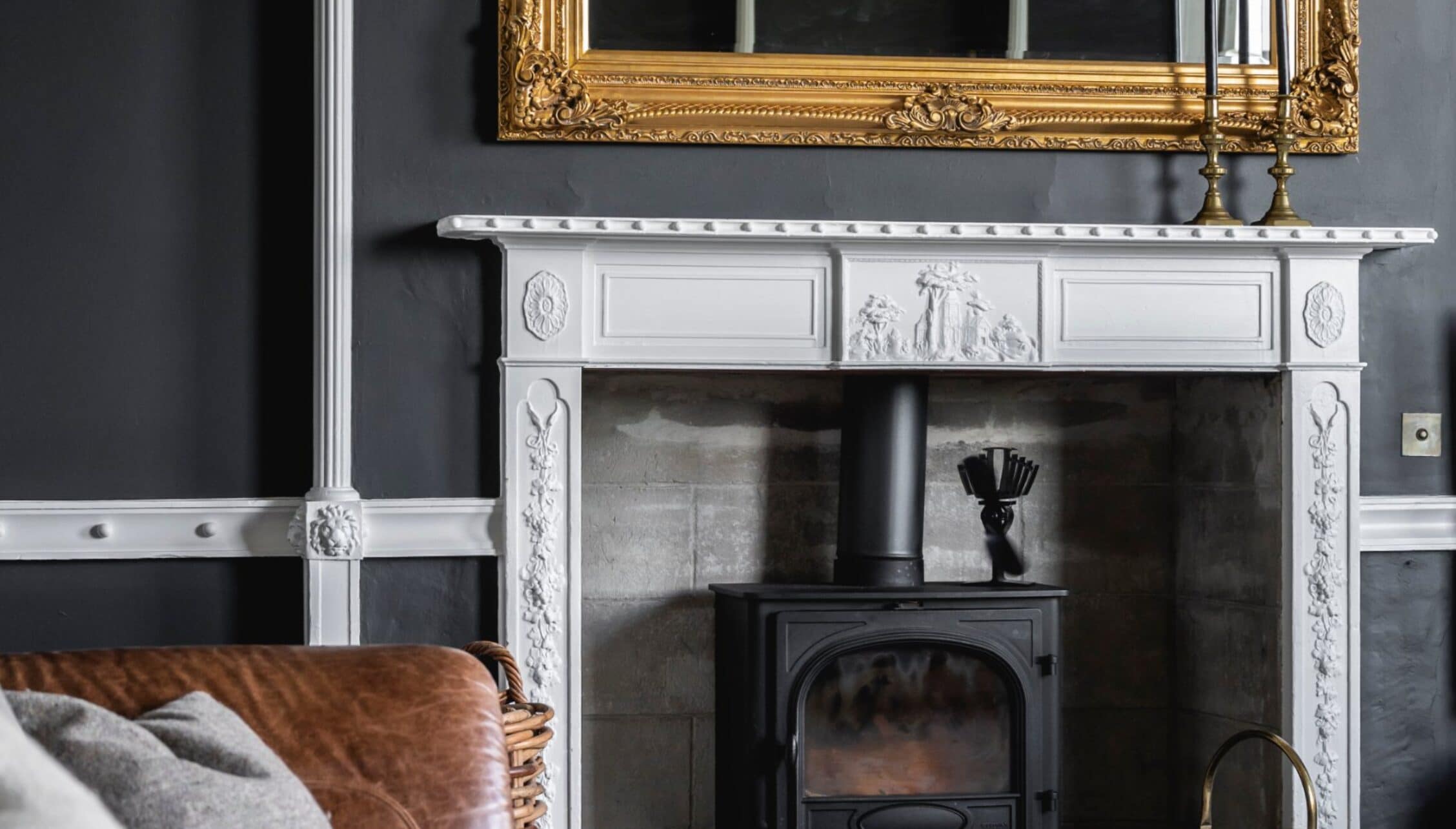 Manar House, Aberdeenshire – Ornate white marble fireplace with black wood-burning stove and gilt-framed mirror.