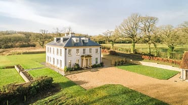 Little Cheriton House – Georgian country house with mansard roof, gravel driveway and manicured grounds.