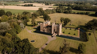 Middleton Castle – Aerial view of castle with moat, formal grounds and surrounding parkland with woodland.