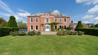Barton Court, Herefordshire – Red-brick Georgian mansion with manicured lawns and topiary hedges.